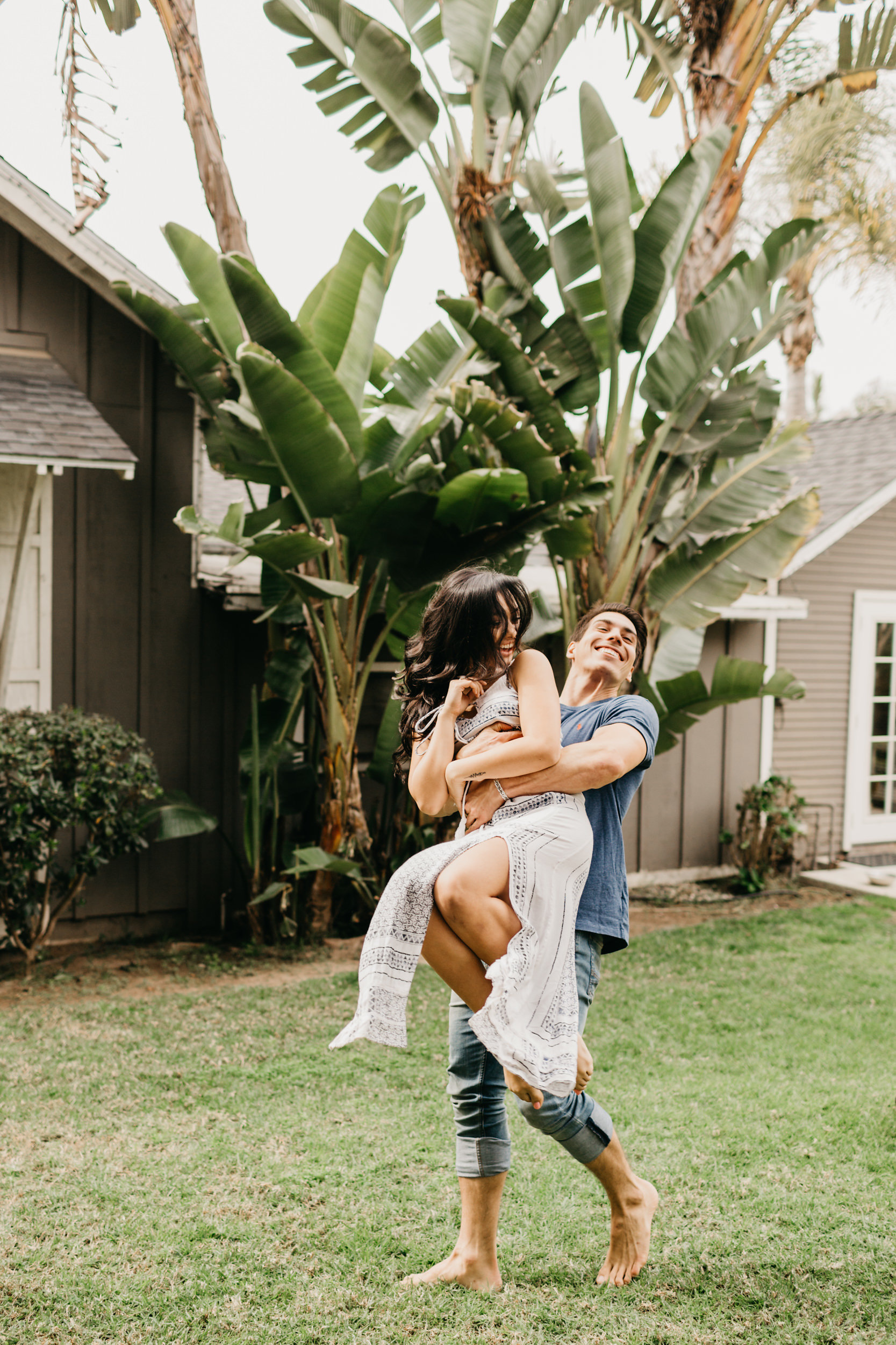 couple in yard laughing 