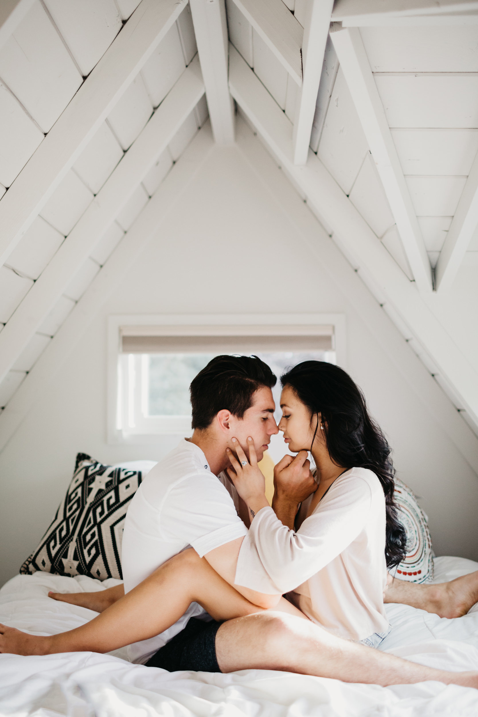 couple kissing in loft