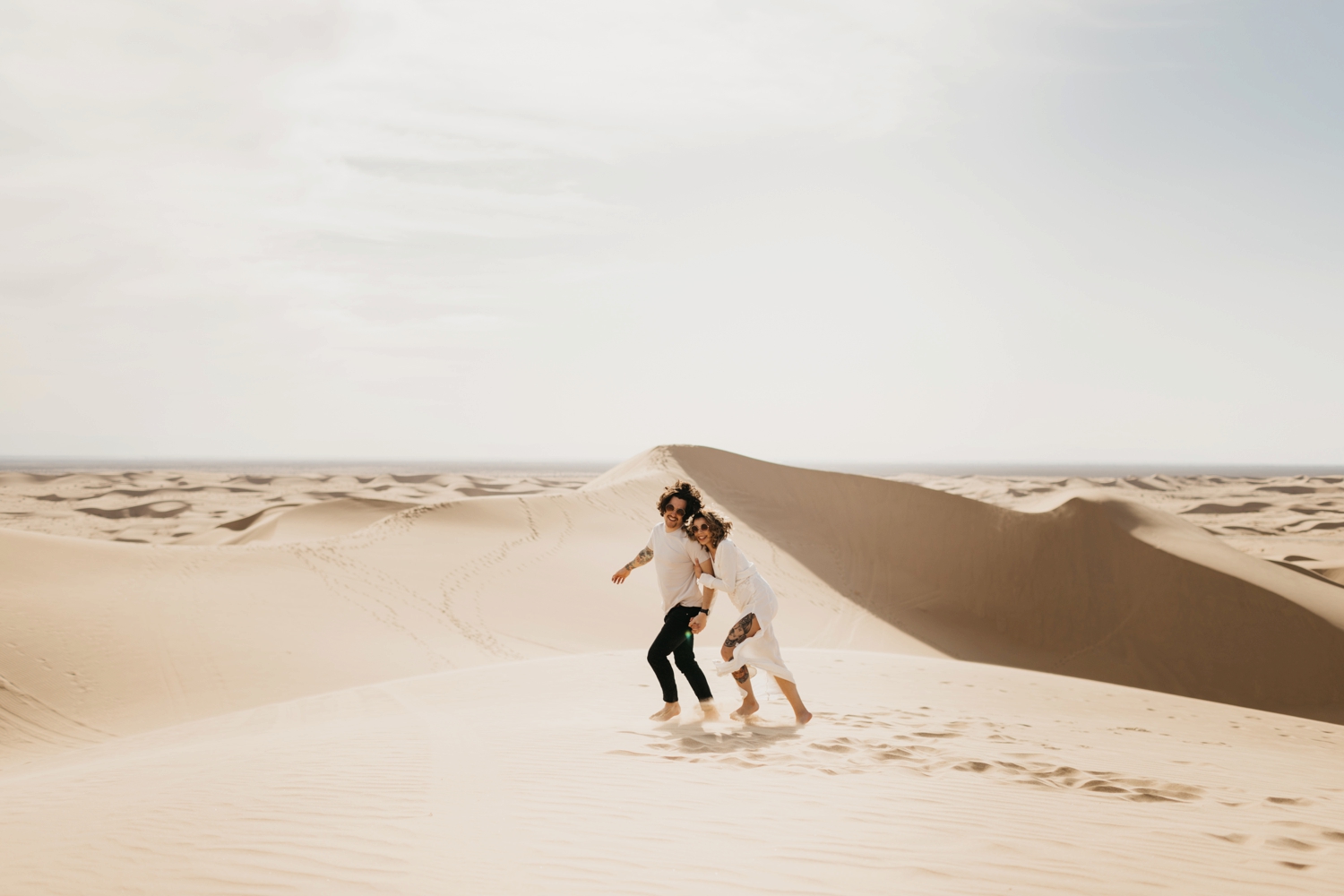 couple in sand dunes
