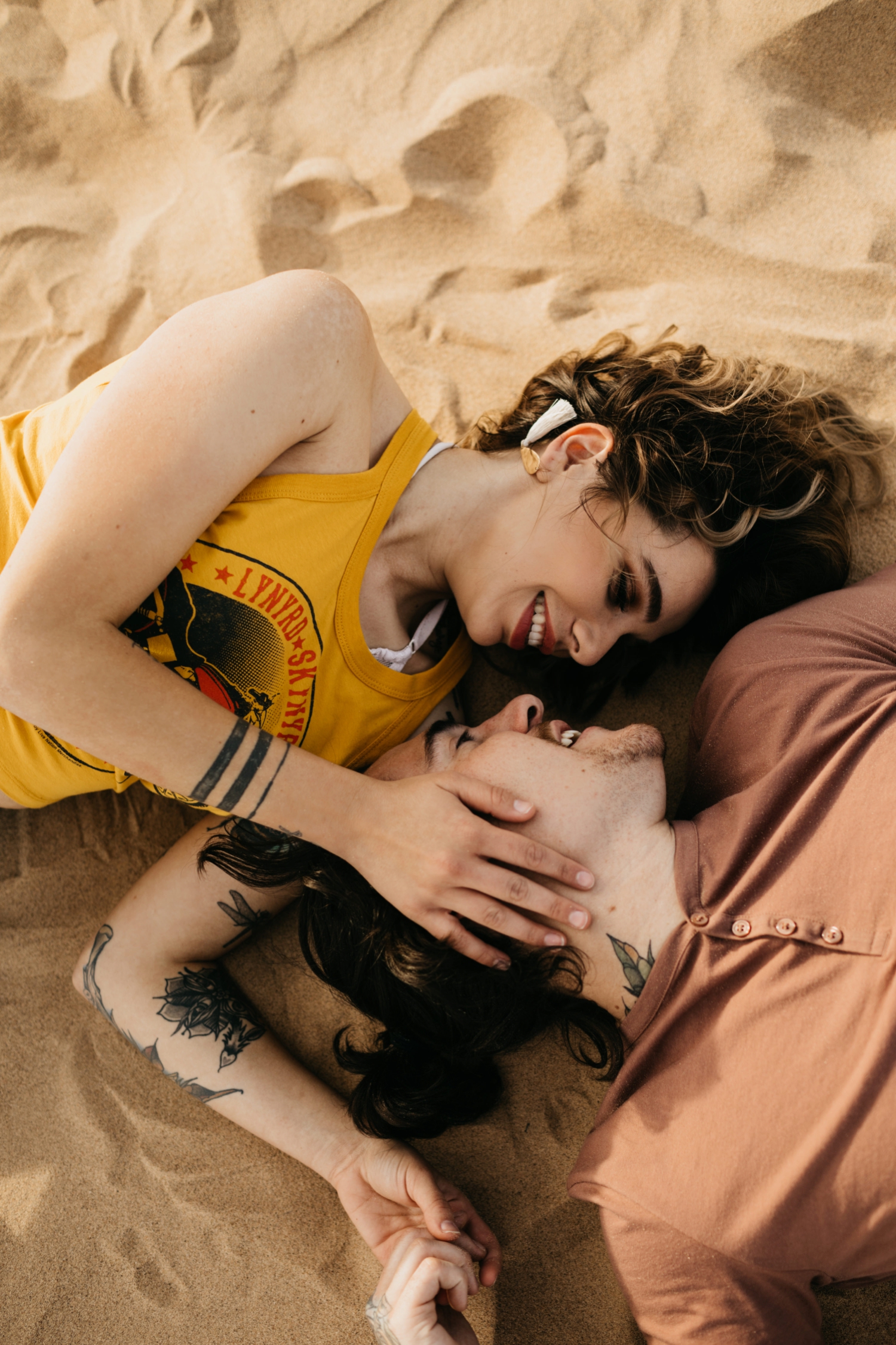 rock and roll engagement shoot in sand dunes 
