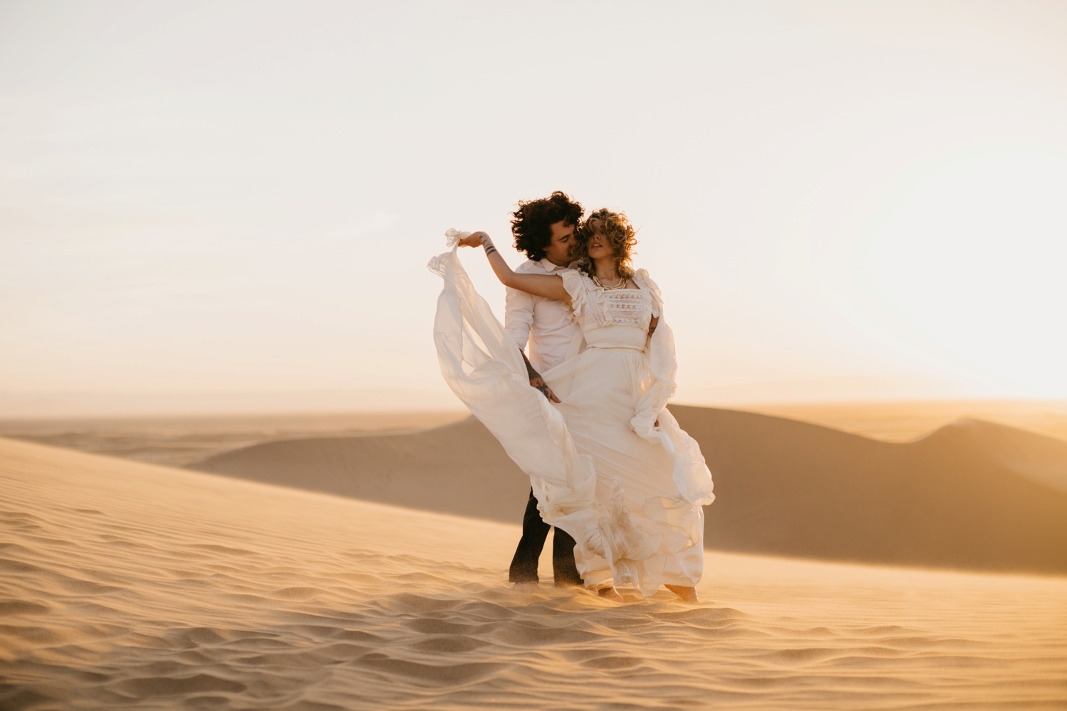 bride groom at sunset in desert 