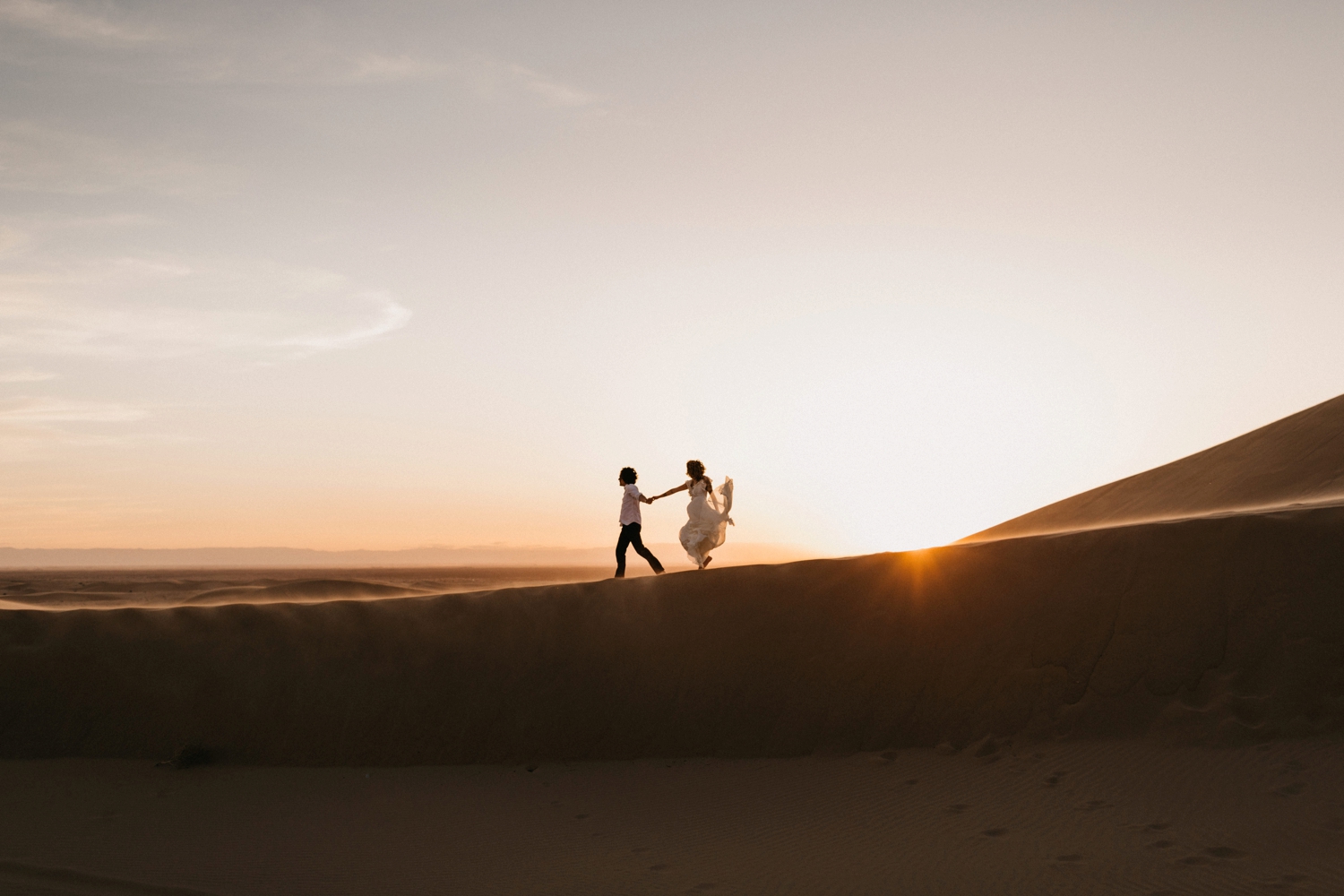 couple at sunset in Morocco desert 